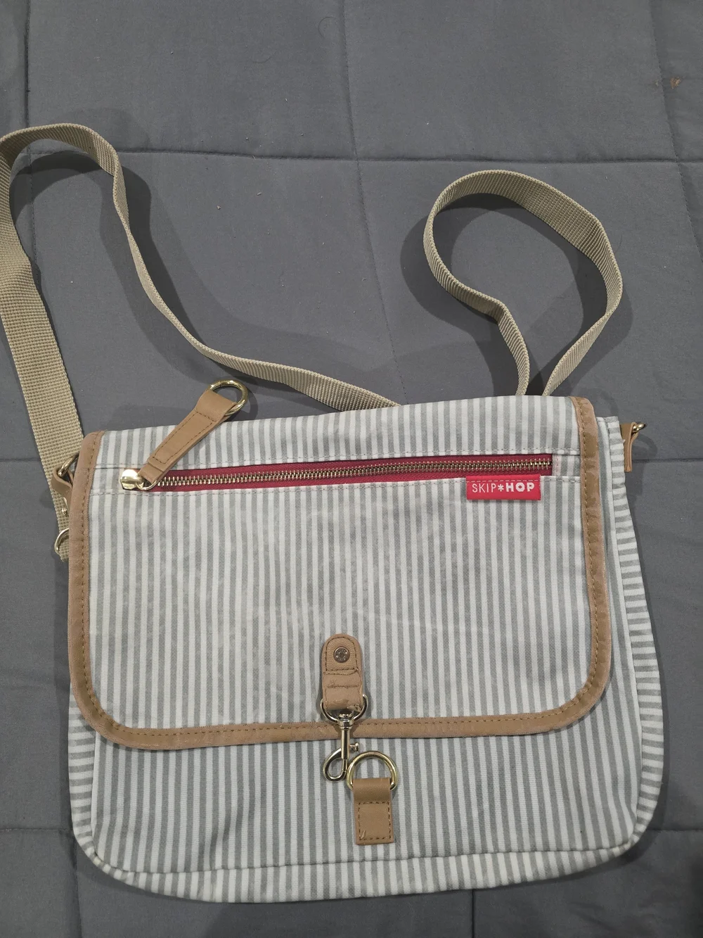 Skip Hop Gray and White Striped Messenger Bag with Tan Trim and Red Accent